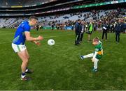 3 April 2022; Five year old Paidi kicks a ball to his dad Paul Geaney of Kerry after the Allianz Football League Division 1 Final match between Kerry and Mayo at Croke Park in Dublin. Photo by Ray McManus/Sportsfile