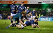 8 April 2022; Hugo Keenan of Leinster scores his side's third try despite the tackle of Cian Prendergast of Connacht during the Heineken Champions Cup Round of 16 first leg match between Connacht and Leinster at the Sportsground in Galway. Photo by Brendan Moran/Sportsfile