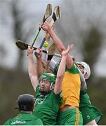 10 April 2022; Fermanagh players, from left, Conor McShea, Luca McCusker, and Tom Keenan, in action against Danny Cullen of Donegal during the Nickey Rackard Cup Round 1 match between Fermanagh and Donegal at St Mary's GAA Club in Maguiresbridge, Fermanagh. Photo by Ramsey Cardy/Sportsfile
