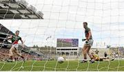 4 August 2013; Donal Vaughan, Mayo, left, shoots to score his side's second goal. GAA Football All-Ireland Senior Championship, Quarter-Final, Mayo v Donegal, Croke Park, Dublin. Picture credit: Stephen McCarthy / SPORTSFILE