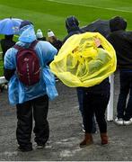 17 April 2022; A spectator puts on her rain cover before the Munster GAA Hurling Senior Championship Round 1 match between Waterford and Tipperary at Walsh Park in Waterford. Photo by Piaras Ó Mídheach/Sportsfile