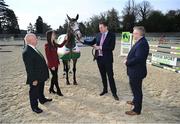 22 April 2022; The road to the World Championships for young horses began as Horse Sport Ireland launched the 2022 HSI Studbook Series. For the first time, the competition is open to horses from all Department of Agriculture, Food and the Marine approved studbooks and with €80,000 in prizemoney on offer HSI are expecting a strong entry as crowds return for the first time since the start of the COVID19 pandemic. The HSI Studbook Series provides a platform for younger horses to compete and develop in classes for five, six and seven-year-olds and offers them an opportunity to progress towards competing at the FEI WBFSH World Breeding Jumping Championships for Young Horses in Lanaken, Belgium, in the autumn. Charlie McConalogue TD, Minister for Agriculture, Food and Marine, holding the Irish Sport Horse, Danos Lola, with, from left, Joe Reynolds, chairman, Horse Sport Ireland, Dr Sonja Egan, interim head of breeding, innovation and development, Horse Sport Ireland, and Denis Duggan, chief executive officer, Horse Sport Ireland, during the 2022 Horse Sport Ireland Studbook Series launch at the National Horse Sport Arena on the Sport Ireland Campus in Blanchardstown, Dublin. Photo by Stephen McCarthy/Sportsfile