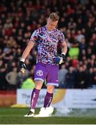 22 April 2022; Bohemians goalkeeper James Talbot removes a flare from the pitch before the SSE Airtricity League Premier Division match between Bohemians and Shamrock Rovers at Dalymount Park in Dublin. Photo by Stephen McCarthy/Sportsfile