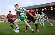 22 April 2022; Rory Gaffney of Shamrock Rovers in action against Tyreke Wilson of Bohemians during the SSE Airtricity League Premier Division match between Bohemians and Shamrock Rovers at Dalymount Park in Dublin. Photo by Stephen McCarthy/Sportsfile
