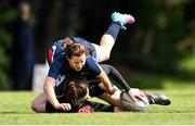 23 April 2022; Emer Kelly of Kilkenny RFC scores a try despite the tackle of Eileen Shanahan of Tallaght RFC during the Division 5 Cup Final match between Kilkenny RFC and Tallaght RFC at Ollie Campbell Park, Old Belvedere RFC in Dublin. Photo by Ben McShane/Sportsfile