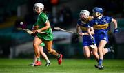 23 April 2022; Michelle Curtin of Limerick in action against Niamh Treacy, left, and Eimear Loughman of Tipperary during the Munster Senior Camogie Championship Quarter-Final match between Tipperary and Limerick at TUS Gaelic Grounds in Limerick. Photo by Ray McManus/Sportsfile