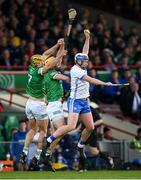 23 April 2022; Stephen Bennett of Waterford catches the sliothar ahead of Limerick's Tom Morrisey and Dan Morrisey, left, during the Munster GAA Hurling Senior Championship Round 2 match between Limerick and Waterford at TUS Gaelic Grounds in Limerick. Photo by Stephen McCarthy/Sportsfile