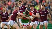 24 April 2022; Jason Doherty of Mayo is tackled by Johnny Heaney, left, and John Daly of Galway during the Connacht GAA Football Senior Championship Quarter-Final match between Mayo and Galway at Hastings Insurance MacHale Park in Castlebar, Mayo. Photo by Brendan Moran/Sportsfile