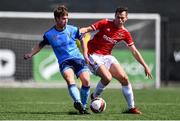 26 April 2022; Rossa McAllister of UCD in action against Adam Green of Queen's University Belfast during the Collingwood Cup Final match between UCD and Queens University Belfast at Oriel Park in Dundalk, Louth. Photo by Ben McShane/Sportsfile