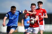 26 April 2022; Adam Lennon of UCD in action against Matt Doherty of Queen's University Belfast during the Collingwood Cup Final match between UCD and Queens University Belfast at Oriel Park in Dundalk, Louth. Photo by Ben McShane/Sportsfile