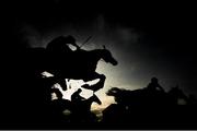 27 April 2022; Runners and riders jump the last during the OMC Claims Handicap Steeplechase on day two of the Punchestown Festival at Punchestown Racecourse in Kildare. Photo by Seb Daly/Sportsfile