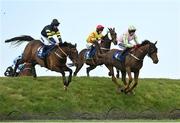 28 April 2022; Ballyboker Bridge, left, with Tiernan Power Roche up, jumps Ruby's Double on their way to winning the Mongey Communications La Touche Cup Cross Country Steeplechase, alongside Call It Magic, right, with Keith Donoghue up, during day three of the Punchestown Festival at Punchestown Racecourse in Kildare. Photo by Seb Daly/Sportsfile