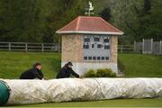 1 May 2022; Groundstaff roll out the covers as rain causes a delay before the Arachas Super Series 2022 50-over Cup match between Typhoons and Scorchers at Merrion Cricket Club in Dublin. Photo by Sam Barnes/Sportsfile