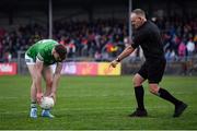30 April 2022; Referee Conor Lane asks James Naughton of Limerick to reposition the ball before he scored the winning penalty in the penalty shoot-out of the Munster GAA Senior Football Championship Quarter-Final match between Clare and Limerick at Cusack Park in Ennis, Clare. Photo by Piaras Ó Mídheach/Sportsfile