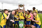 8 May 2022; Lee Morely of Douglas Hall lifts the cup as he celebrates with team-mates after his side's victory in the FAI Centenary Youth Cup Final 2021/2022 match between Ringmahon Rangers and Douglas Hall at Turner's Cross in Cork. Photo by Sam Barnes/Sportsfile