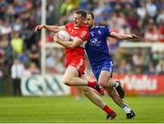15 May 2022; Emmett Bradley of Derry in action against Conor Boyle of Monaghan during the Ulster GAA Football Senior Championship Semi-Final match between Derry and Monaghan at Athletic Grounds in Armagh. Photo by Daire Brennan/Sportsfile