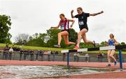 18 May 2022; Della McLoughlin of Coláiste Íosagáin, Portarlington, Offaly, left, and Alison Walsh of Mount Anville Secondary School, Dublin, competing in the Intermediate Girls 1500 metres Steeplechase during day one of the Irish Life Health Leinster Schools Track and Field Championships at Morton Stadium in Santry, Dublin. Photo by Seb Daly/Sportsfile