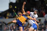 22 May 2022; Clare's Peter Duggan supported by Robin Mounsey, is tackled by Ian Kenny and Conor Gleeson, 3, during the Munster GAA Hurling Senior Championship Round 5 match between Clare and Waterford at Cusack Park in Ennis, Clare. Photo by Ray McManus/Sportsfile