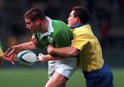 21 November 1998: Ciaran Scally of Ireland is tackled by Peter Mitu of Romania during the World Cup Qualifing match between Ireland and Romania at Lansdowne Road in Dublin. Photo by David Maher/Sportsfile