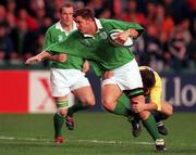21 November 1998: Dion O'Cuinneagain of Ireland is tackled by Peter Mitu of Romania during the World Cup Qualifing match between Ireland and Romania at Lansdowne Road in Dublin. Photo by David Maher/Sportsfile