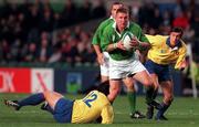21 November 1998: Jonathan Bell of Ireland is tackled by Romeo Gontineac of Romania during the World Cup Qualifing match between Ireland and Romania at Lansdowne Road in Dublin. Photo by David Maher/Sportsfile