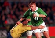 21 November 1998: Jonathan Bell of Ireland is tackled by Gheorghe Solomie of Romania during the World Cup Qualifing match between Ireland and Romania at Lansdowne Road in Dublin. Photo by David Maher/Sportsfile
