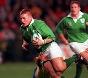 21 November 1998: Jonathan Bell of Ireland is tackled by Gheorghe Solomie of Romania during the World Cup Qualifing match between Ireland and Romania at Lansdowne Road in Dublin. Photo by David Maher/Sportsfile