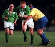 21 November 1998: Jonathan Bell of Ireland is tackled by Dragos Niculas of Romania during the World Cup Qualifing match between Ireland and Romania at Lansdowne Road in Dublin. Photo by David Maher/Sportsfile