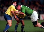 21 November 1998: Victor Costello of Ireland is tackled by Florin Corodeanu and Roland Vusec of Romania during the World Cup Qualifing match between Ireland and Romania at Lansdowne Road in Dublin. Photo by David Maher/Sportsfile