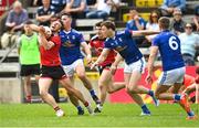 28 May 2022; Barry O'Hagan of Down in action against Killian Brady and Gearóid McKiernan of Cavan during the Tailteann Cup Round 1 match between Cavan and Down at Kingspan Breffni in Cavan. Photo by Oliver McVeigh/Sportsfile