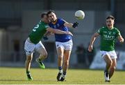 28 May 2022; Mark Hughes of Longford in action against Aidan Breen of Fermanagh  during the Tailteann Cup Round 1 match between Longford and Fermanagh at Glennon Brothers Pearse Park in Longford. Photo by Sam Barnes/Sportsfile