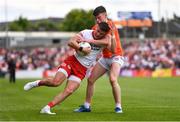5 June 2022; Michael McKernan of Tyrone is tackled by Aidan Nugent of Armagh during the GAA Football All-Ireland Senior Championship Round 1 match between Armagh and Tyrone at Athletic Grounds in Armagh. Photo by Ben McShane/Sportsfile