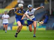 5 June 2022; Niamh Treacy of Tipperary is tackled by Mairead O'Brien of Waterford during the Glen Dimplex Senior Camogie Championship match between Tipperary and Waterford at Semple Stadium in Thurles, Tipperary. Photo by Ray McManus/Sportsfile