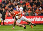 5 June 2022; Aidan Forker of Armagh is tackled by Conor McKenna of Tyrone during the GAA Football All-Ireland Senior Championship Round 1 match between Armagh and Tyrone at Athletic Grounds in Armagh. Photo by Ramsey Cardy/Sportsfile