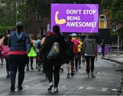 5 June 2022; Participants passing the Vhi motivation station in the 2022 Vhi Women’s Mini Marathon in Dublin. 20,000 women from all over the country took to the streets of Dublin to run, walk and jog the 10km route, raising much needed funds for hundreds of charities around the country. www.vhiwomensminimarathon.ie Photo by Seb Daly/Sportsfile