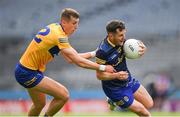 11 June 2022; Ciaráin Murtagh of Roscommon is tackled by Emmet McMahon of Clare during the GAA Football All-Ireland Senior Championship Round 2 match between Clare and Roscommon at Croke Park in Dublin. Photo by Ray McManus/Sportsfile