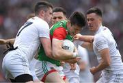 11 June 2022; Conor Loftus of Mayo is tackled by David Hyland, left, and Mick O'Grady of Kildare during the GAA Football All-Ireland Senior Championship Round 2 match between Mayo and Kildare at Croke Park in Dublin. Photo by Ray McManus/Sportsfile