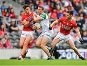 12 June 2022; Darragh Treacy of Limerick is tackled by Colm O’Callaghan of Cork during the GAA Football All-Ireland Senior Championship Round 2 match between between Cork and Limerick at Páirc Ui Chaoimh in Cork. Photo by Eóin Noonan/Sportsfile