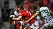 12 June 2022; Mattie Taylor of Cork is tackled by Cillian Fahy of Limerick during the GAA Football All-Ireland Senior Championship Round 2 match between between Cork and Limerick at Páirc Ui Chaoimh in Cork. Photo by Eóin Noonan/Sportsfile