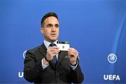 14 June 2022; UEFA Senior Competitions Manager Tom Barlow draws out the card of '8' during the UEFA Europa Conference League 2022/23 First Qualifying Round draw at the UEFA headquarters, The House of European Football, in Nyon, Switzerland. Photo by Kristian Skeie - UEFA via Sportsfile