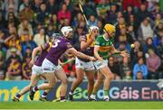 11 June 2022; Niall Mulcahy of Kerry in action against Oisín Foley and Conor Devitt of Wexford during the GAA Hurling All-Ireland Senior Championship Preliminary Quarter-Final match between Kerry and Wexford at Austin Stack Park in Tralee, Kerry. Photo by Diarmuid Greene/Sportsfile