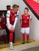17 June 2022; Chris Forrester of St Patrick's Athletic with match day mascot Mason Cox, age 10, before the SSE Airtricity League Premier Division match between St Patrick's Athletic and UCD at Richmond Park in Dublin. Photo by Michael P Ryan/Sportsfile