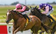 25 June 2022; Night Of Romance, with Dylan Browne McMonagle up, on their way to winning The Dubai Duty Free Summer Fillies Handicap from second place Needle Lace with Billy Lee during the Dubai Duty Free Irish Derby Festival at The Curragh Racecourse in Kildare. Photo by Matt Browne/Sportsfile