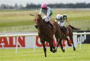 25 June 2022; Westover, with Colin Keane up, on their way to winning the Dubai Duty Free Irish Derby  during the Dubai Duty Free Irish Derby Festival at The Curragh Racecourse in Kildare. Photo by Matt Browne/Sportsfile