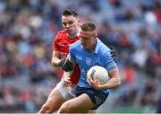 25 June 2022; Paddy Small of Dublin in action against Seán Powter of Cork during the GAA Football All-Ireland Senior Championship Quarter-Final match between Dublin and Cork at Croke Park, Dublin. Photo by David Fitzgerald/Sportsfile