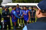 26 June 2022; India debutant Umran Malik, right, is awarded his cap by Bhuvneshwar Kumar before the LevelUp11 First Men's T20 International match between Ireland and India at Malahide Cricket Club in Dublin. Photo by Ramsey Cardy/Sportsfile