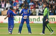 26 June 2022; Dinesh Karthik, left, and Deepak Hooda of India after their side's victory in the LevelUp11 First Men's T20 International match between Ireland and India at Malahide Cricket Club in Dublin. Photo by Ramsey Cardy/Sportsfile