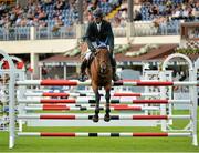 8 August 2013; Edward Doyle, Ireland, competing on Samgemjee, during the Serpentine Speed Stakes. Discover Ireland Dublin Horse Show 2013, RDS, Ballsbridge, Dublin. Picture credit: Barry Cregg / SPORTSFILE