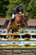 8 August 2013; Denis Lynch, Ireland, competing on All Star 5, on his way to having a clear round during the Serpentine Speed Stakes. Discover Ireland Dublin Horse Show 2013, RDS, Ballsbridge, Dublin. Picture credit: Barry Cregg / SPORTSFILE