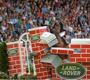 10 August 2013; Daniel Coyle, Ireland, competing on Balou Marco Gii, fails to clear the wall during the Land Rover Puissance. Discover Ireland Dublin Horse Show 2013, RDS, Ballsbridge, Dublin. Picture credit: Barry Cregg / SPORTSFILE